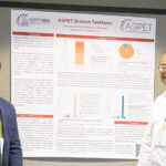 ASPET Biotech Taskforce members Vrushank Bhatt (left) and Marcus Delatte (right), prepare to meet with attendees at ASPET 2024.