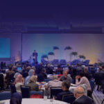 A conference room with ASPET members seated at circular tables during ASPET 2024 in Arlington, Virginia